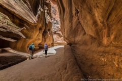 Tourists hiking in the Siq at Petra Jordan